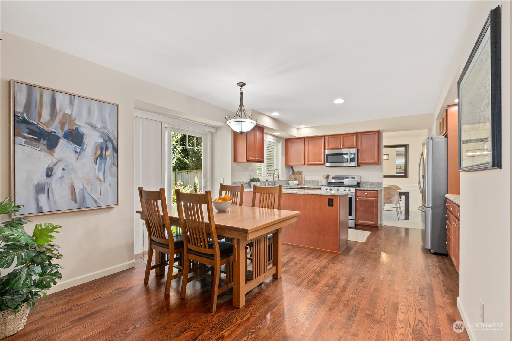 18205 27th Drive Southeast Bothell, WA 98012 - Photo 13 of 37 a view of a dining room with furniture and wooden floor