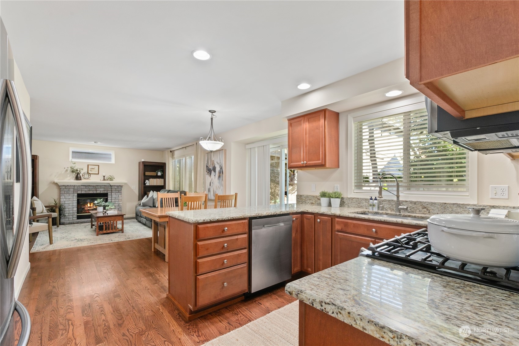 18205 27th Drive Southeast Bothell, WA 98012 - Photo 14 of 37 a kitchen with a sink stove and cabinets