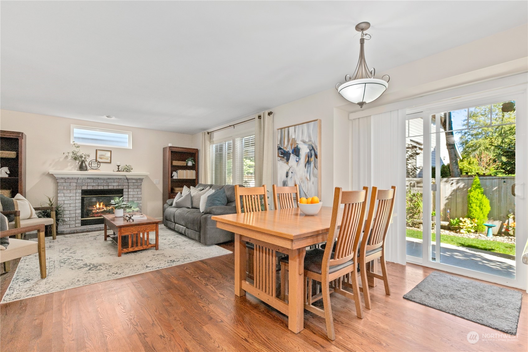 18205 27th Drive Southeast Bothell, WA 98012 - Photo 15 of 37 a dining room with furniture a chandelier and wooden floor