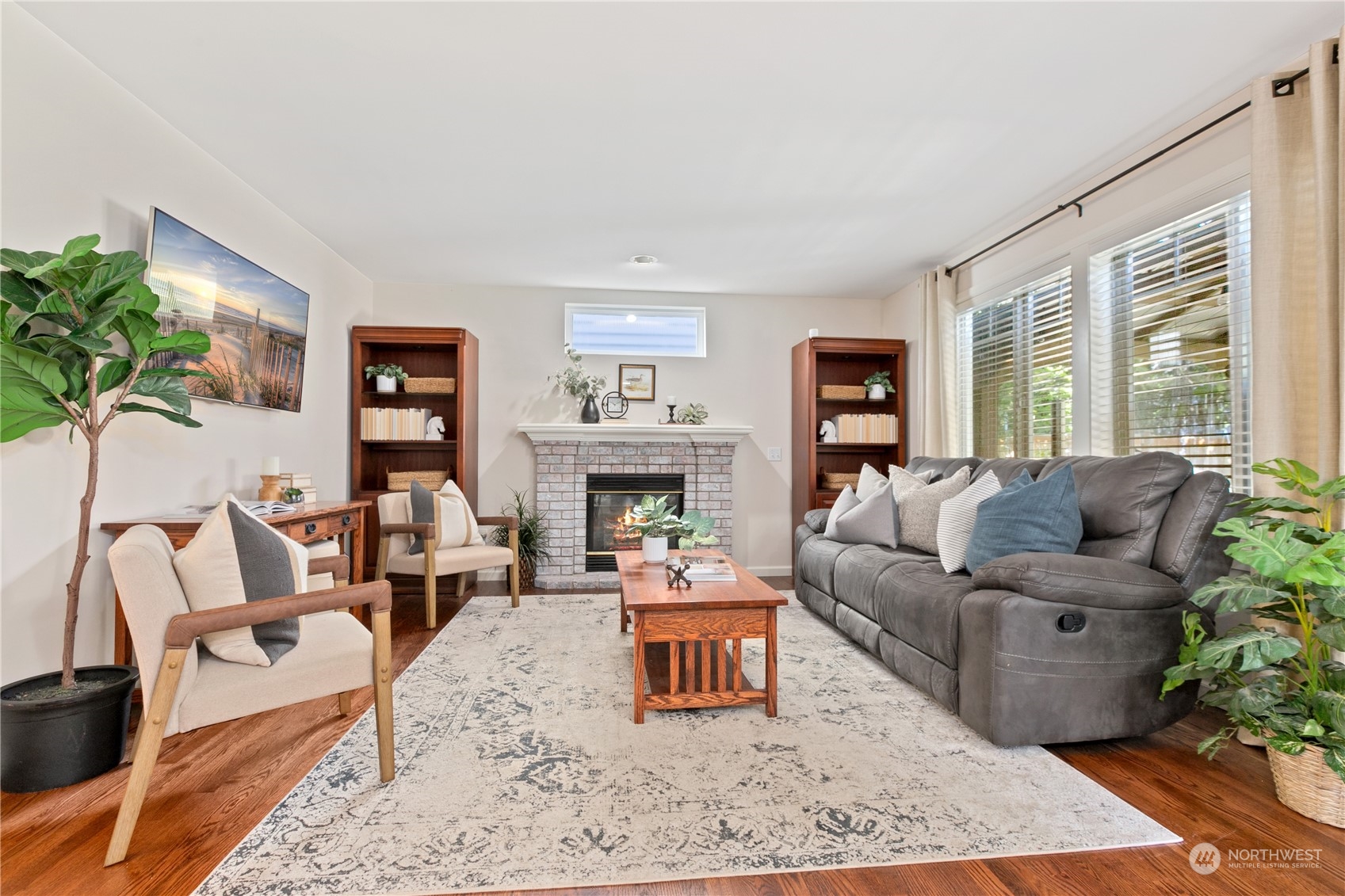 18205 27th Drive Southeast Bothell, WA 98012 - Photo 17 of 37 a living room with furniture large window and a fireplace