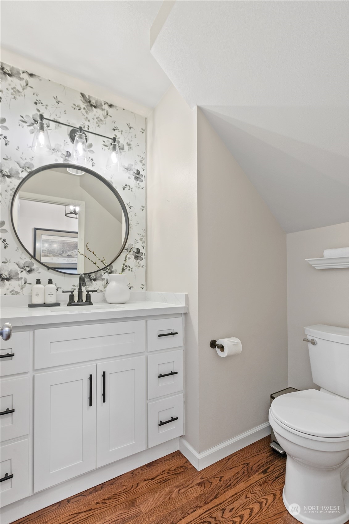 18205 27th Drive Southeast Bothell, WA 98012 - Photo 19 of 37 a bathroom with a granite countertop toilet sink and mirror