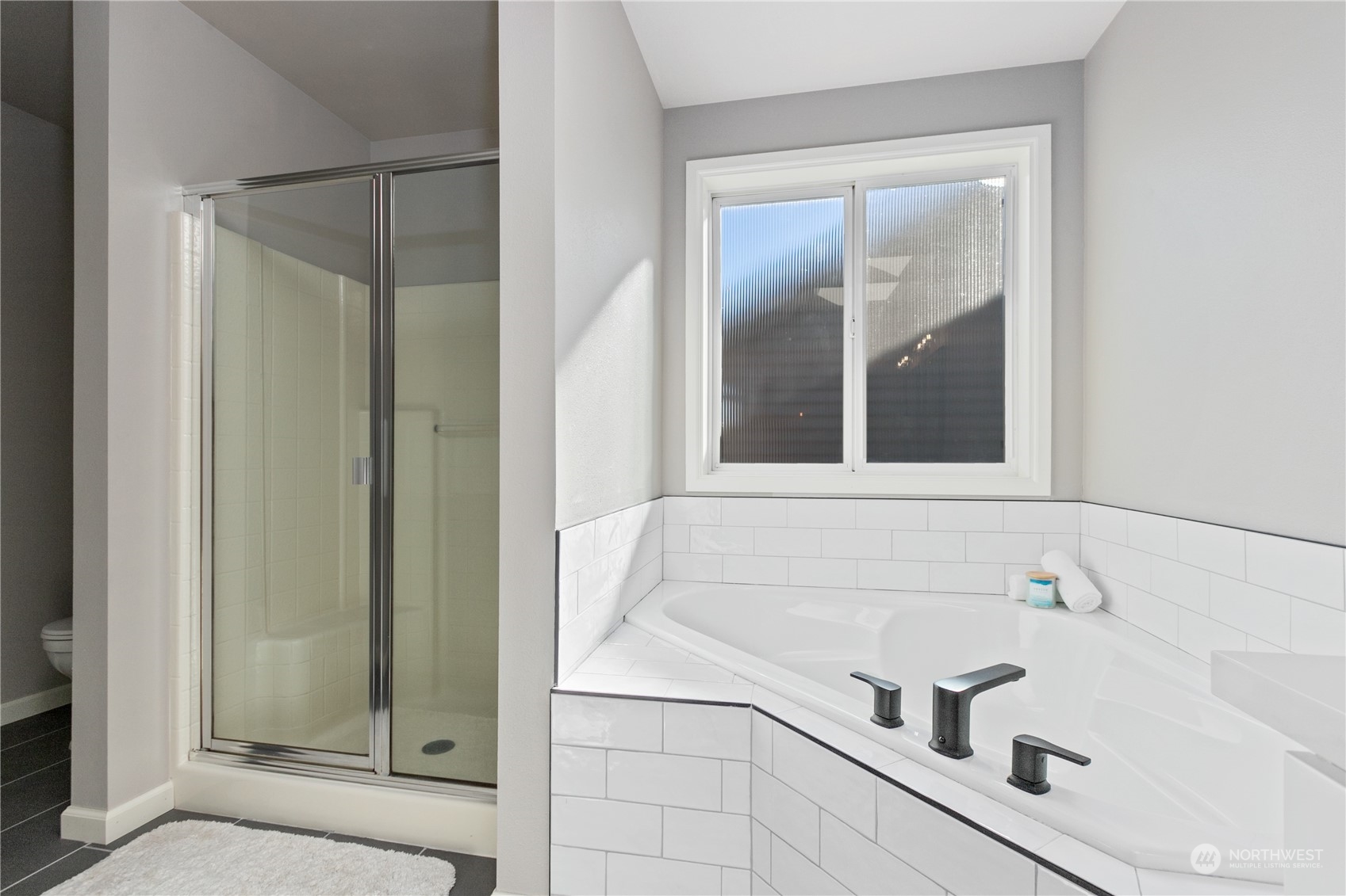 18205 27th Drive Southeast Bothell, WA 98012 - Photo 26 of 37 a bathroom with a bathtub and shower