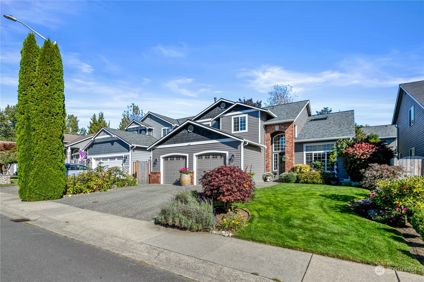 18205 27th Drive Southeast Bothell, WA 98012 - Photo 37 of 37 front view of a house with a garden