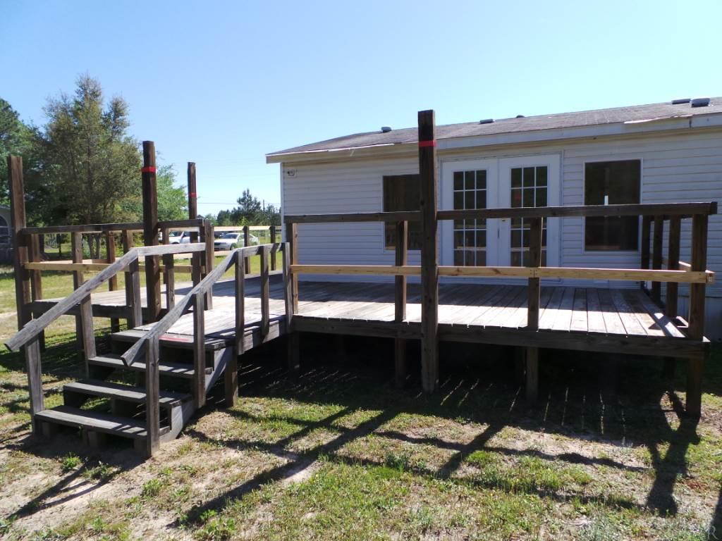 5049 Bodega Road Milton, FL 32583 - Photo 5 of 23 a view of a balcony with chairs