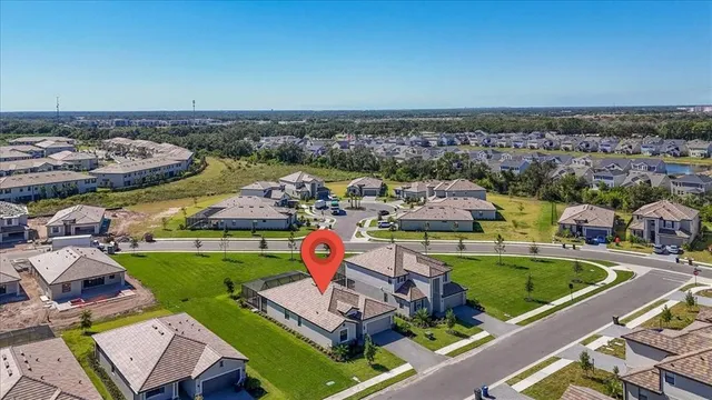 an aerial view of a house with a swimming pool