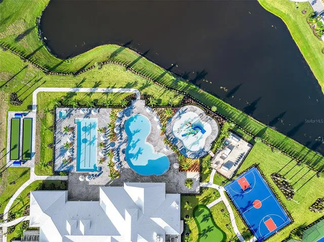 a view of a swimming pool with a lounge chair