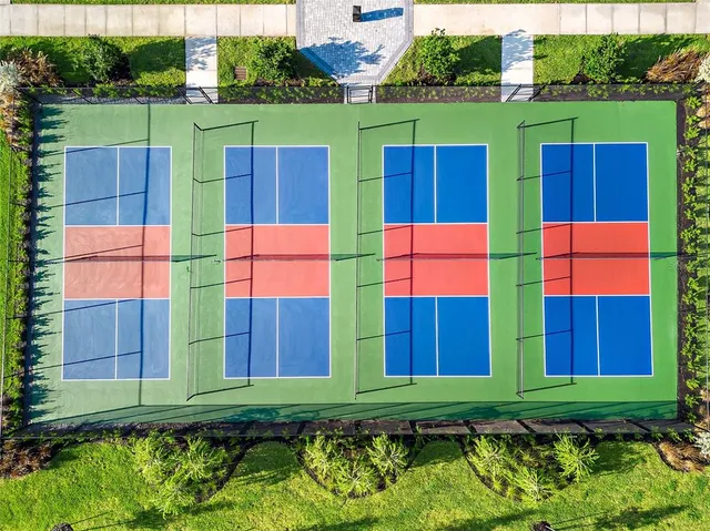 a view of an outdoor space and tennis court