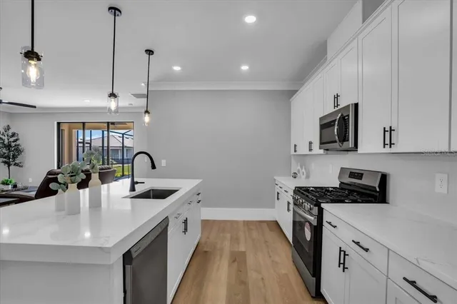 a dining room with furniture window and wooden floor