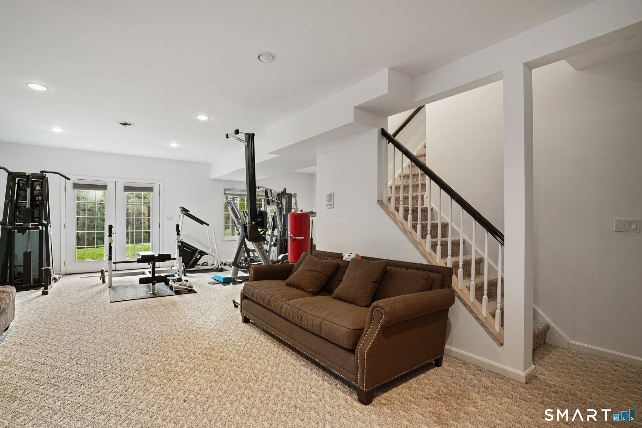 65 Pine Ridge Road Wilton, CT 06897 - Photo 20 of 27 This is an old photo. Lower level has new luxury vinyl plank flooring and gym equipment is now located in separate gym area. New photos coming on 8/26