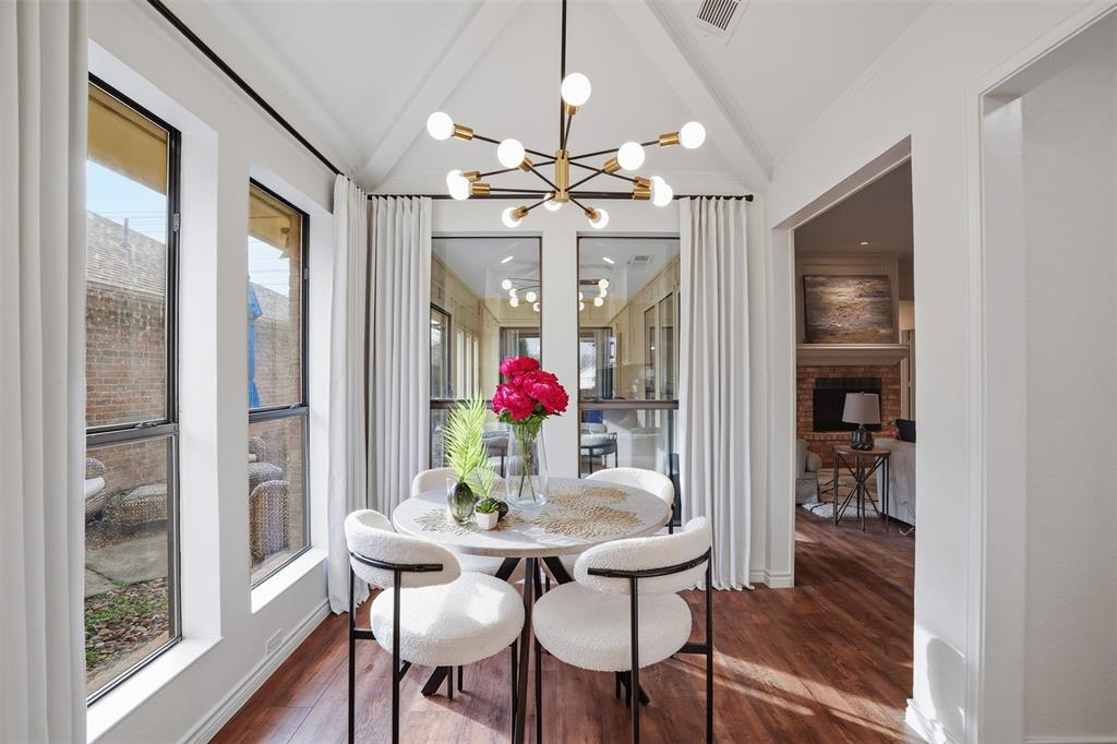 6500 Spur Ranch Court Plano, TX 75023 - Photo 1 of 32 a view of a dining room with furniture window and wooden floor