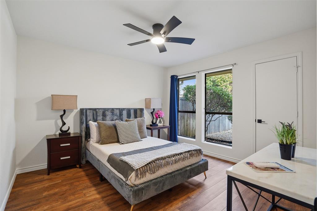 6500 Spur Ranch Court Plano, TX 75023 - Photo 15 of 32 a bedroom with a large bed and a window