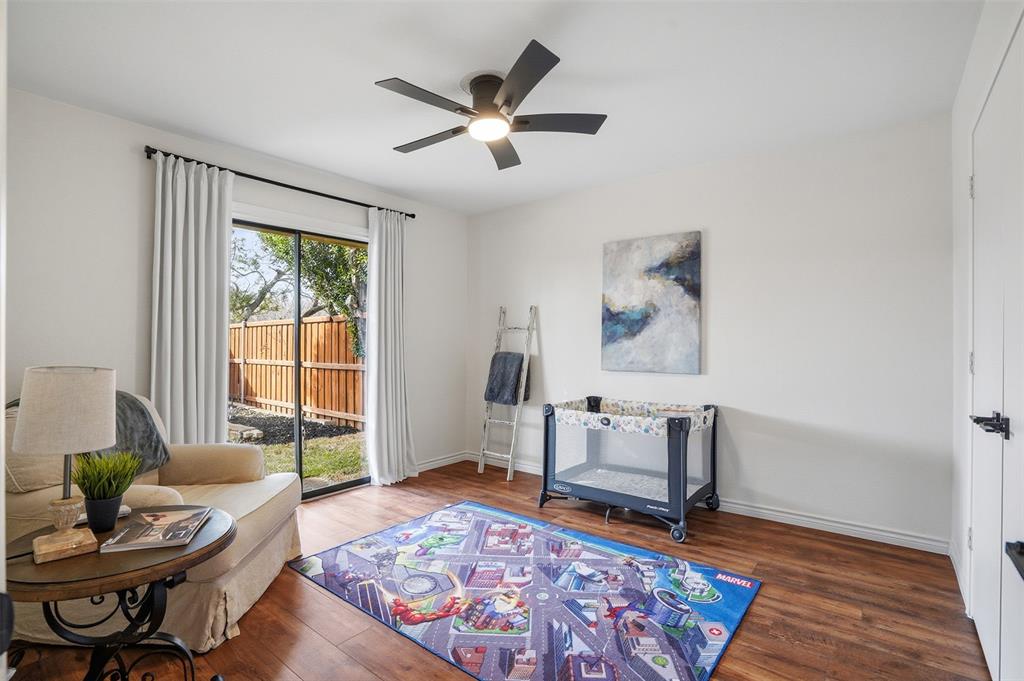 6500 Spur Ranch Court Plano, TX 75023 - Photo 16 of 32 a living room with furniture and a rug