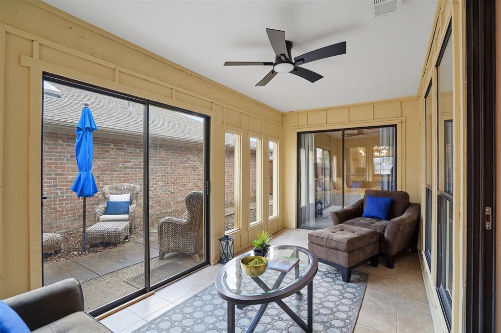 6500 Spur Ranch Court Plano, TX 75023 - Photo 18 of 32 a living room with furniture and a ceiling fan