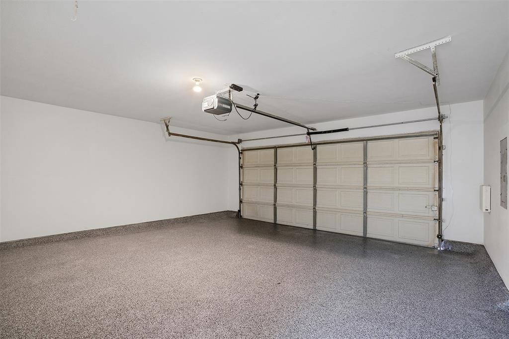 6500 Spur Ranch Court Plano, TX 75023 - Photo 21 of 32 a view of a livingroom with furniture and a ceiling fan