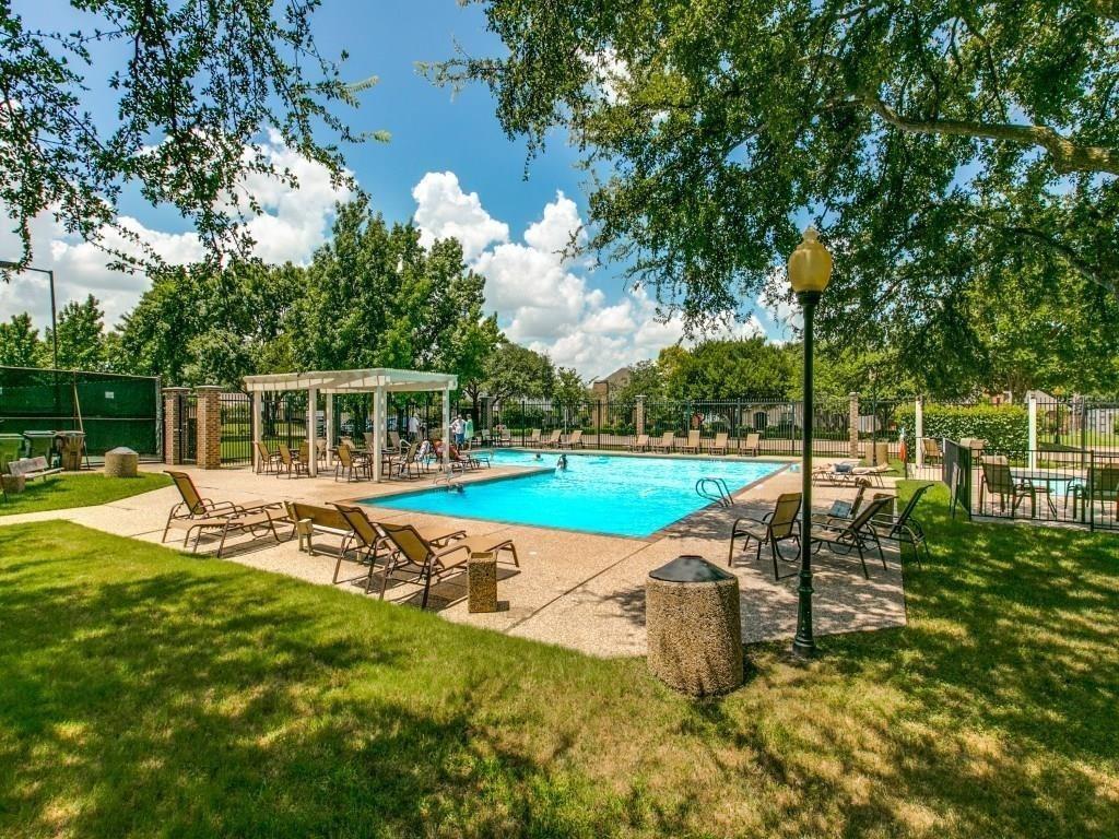 6500 Spur Ranch Court Plano, TX 75023 - Photo 29 of 32 a view of a swimming pool with a chair and tables