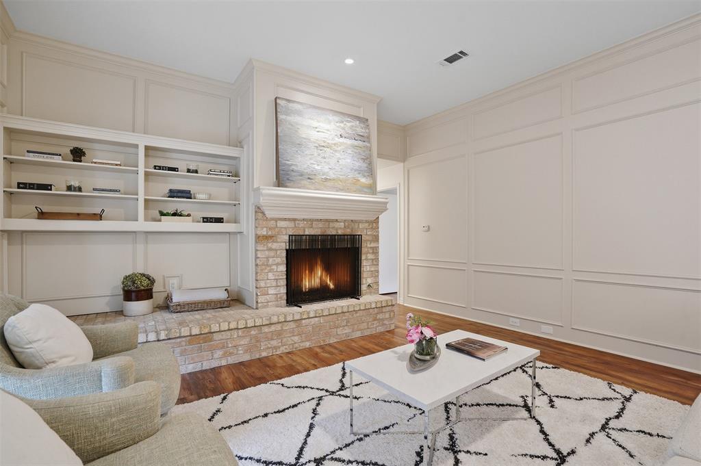 6500 Spur Ranch Court Plano, TX 75023 - Photo 5 of 32 a living room with furniture and a fireplace