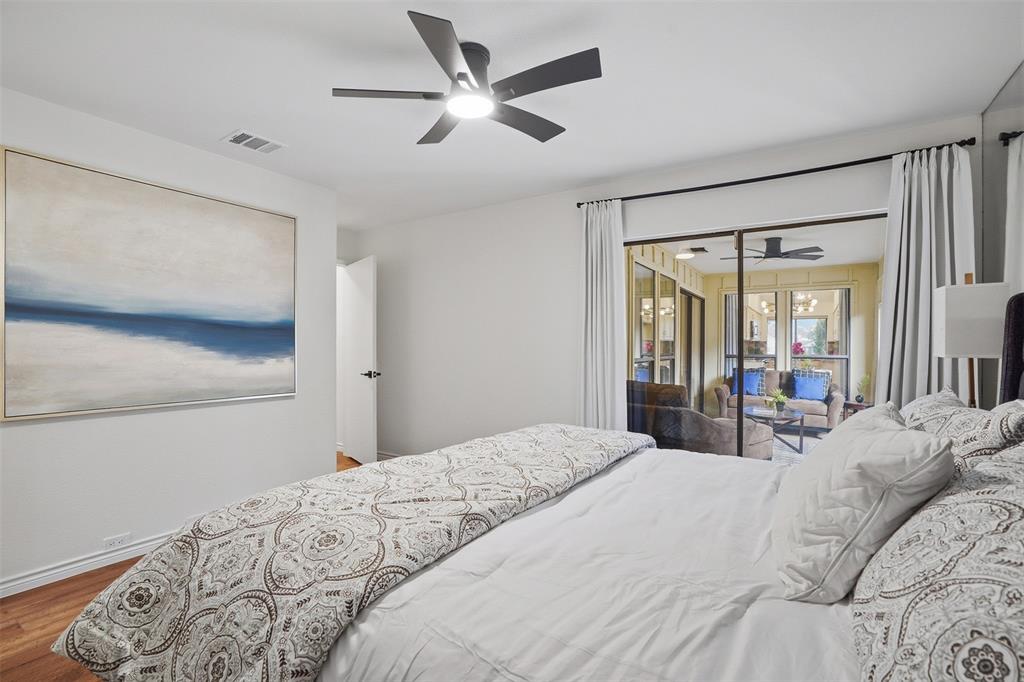 6500 Spur Ranch Court Plano, TX 75023 - Photo 10 of 32 a bedroom with a large bed and a large window