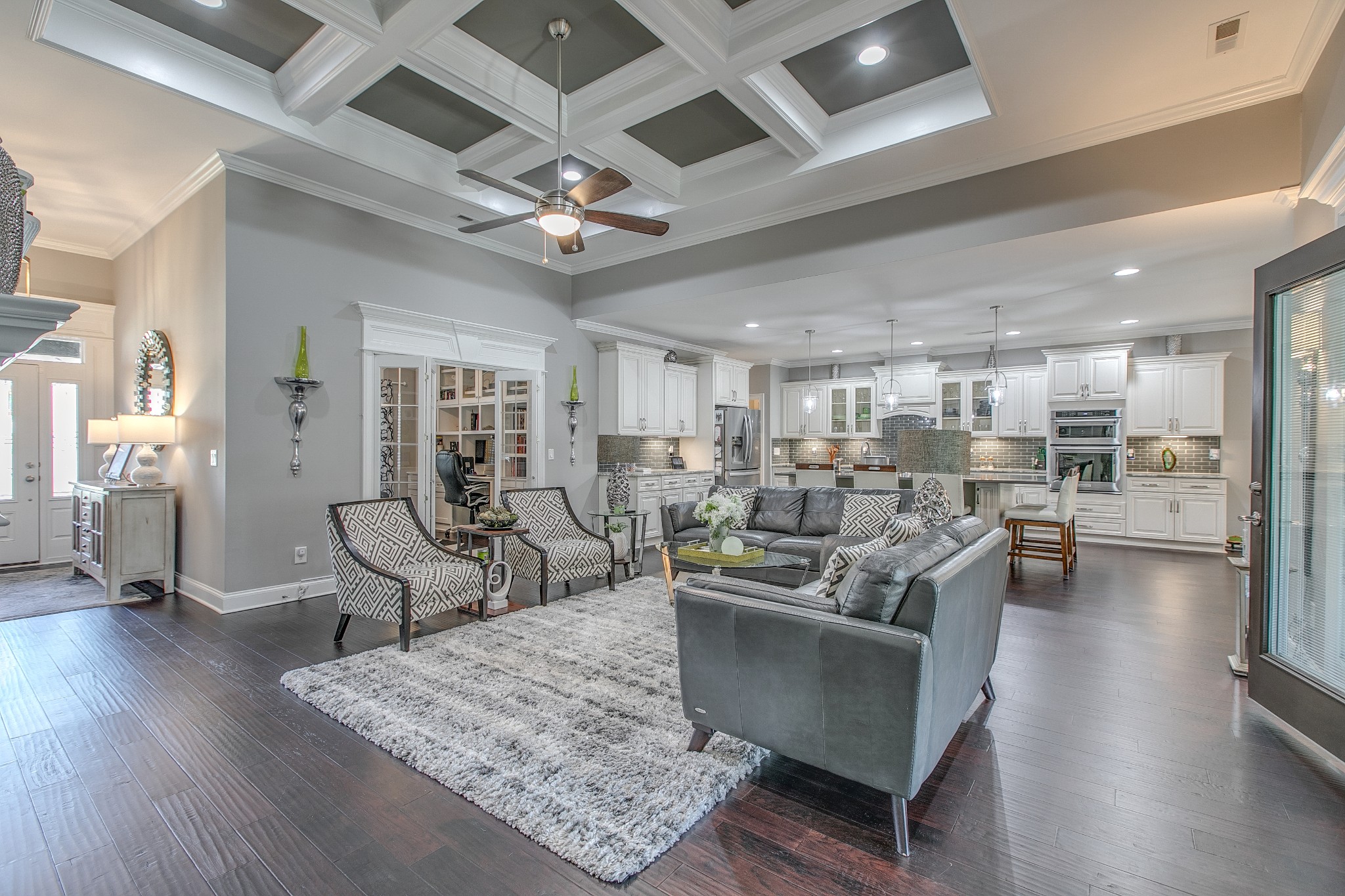 7745 Santos Drive Murfreesboro, TN 37129 - Photo 11 of 58 a living room with furniture wooden floor and a view of kitchen