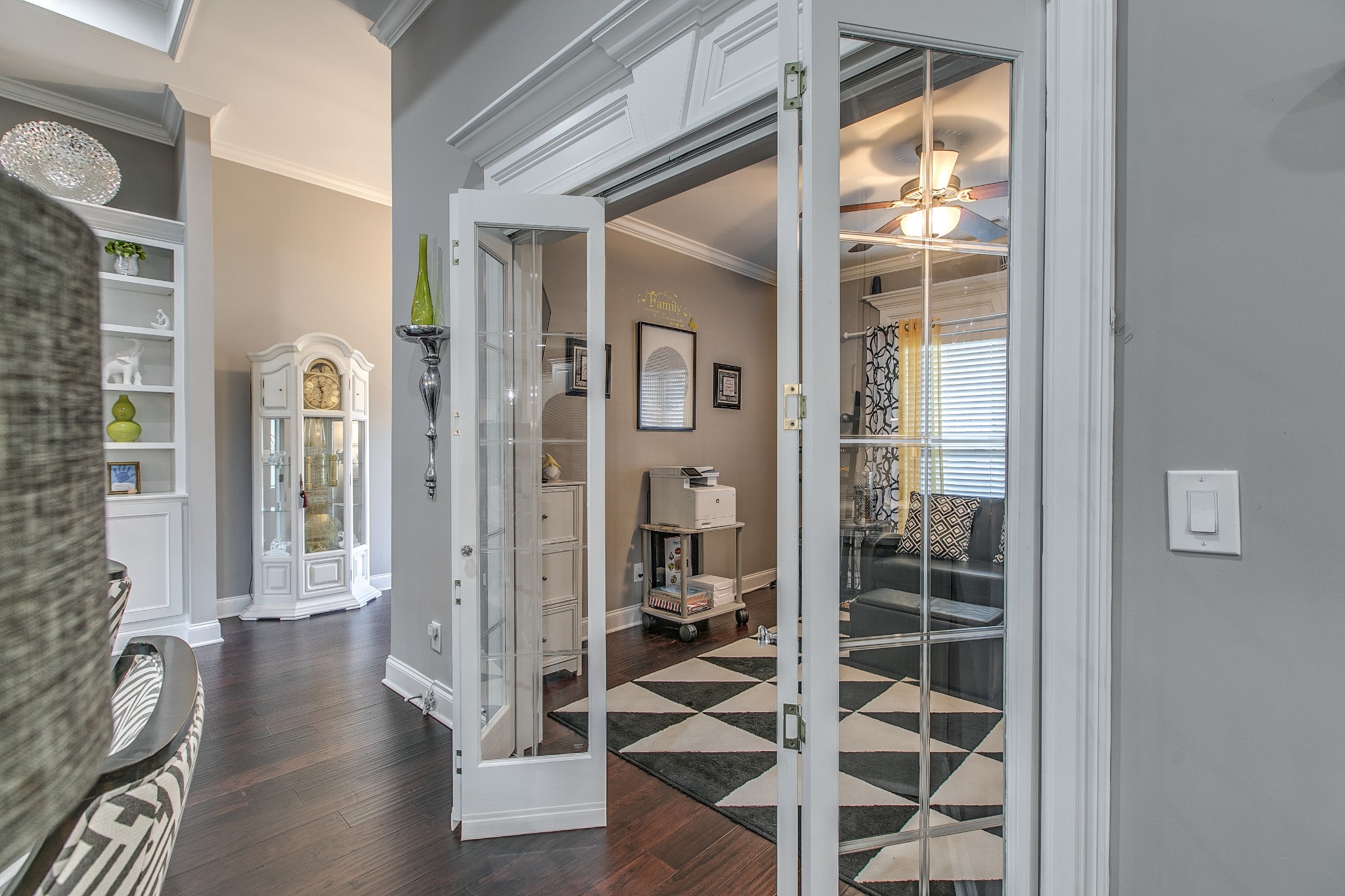 7745 Santos Drive Murfreesboro, TN 37129 - Photo 12 of 58 a view of a hallway with wooden floor and windows