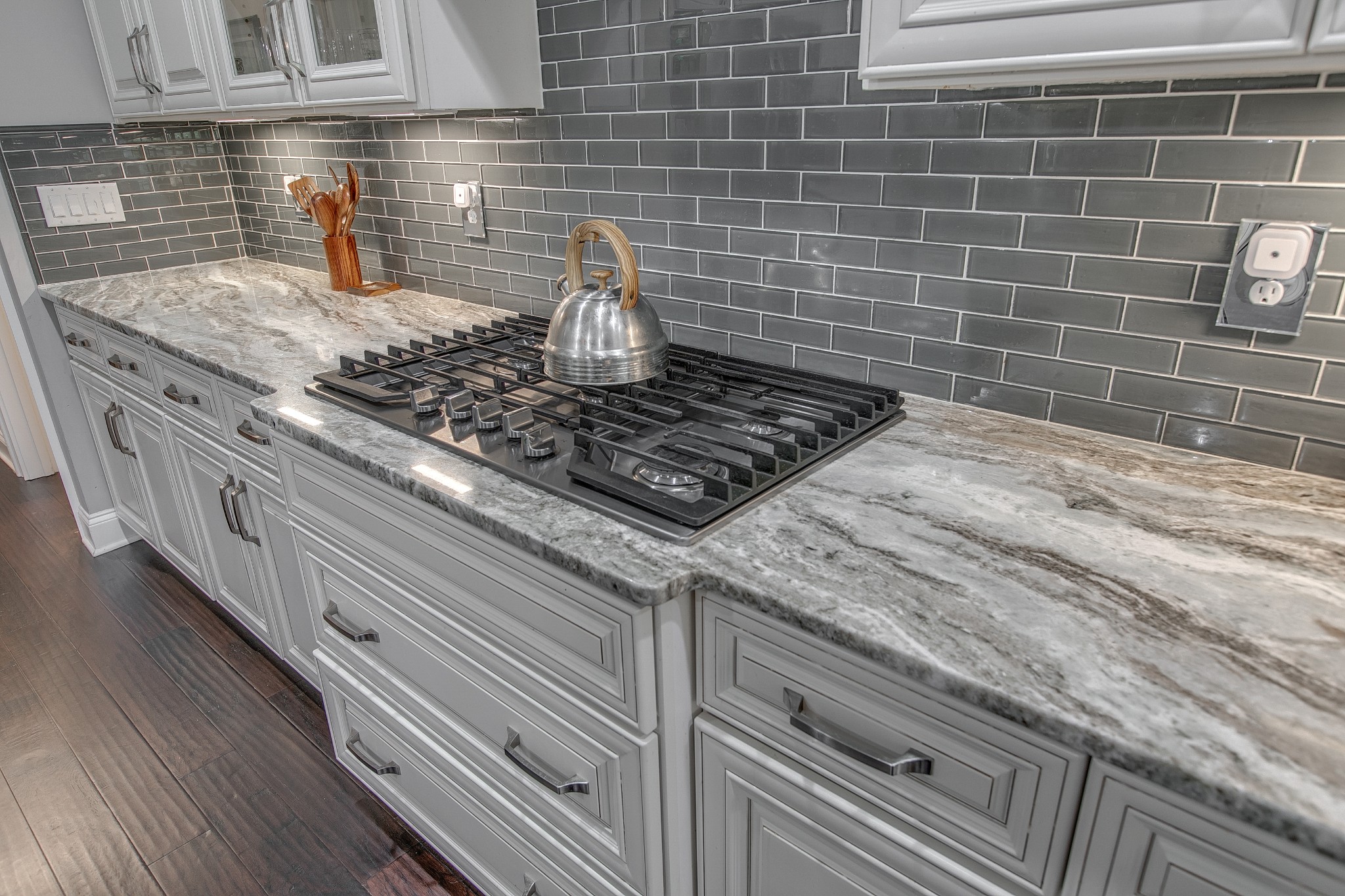 7745 Santos Drive Murfreesboro, TN 37129 - Photo 17 of 58 a kitchen with granite countertop a sink a stove and cabinets