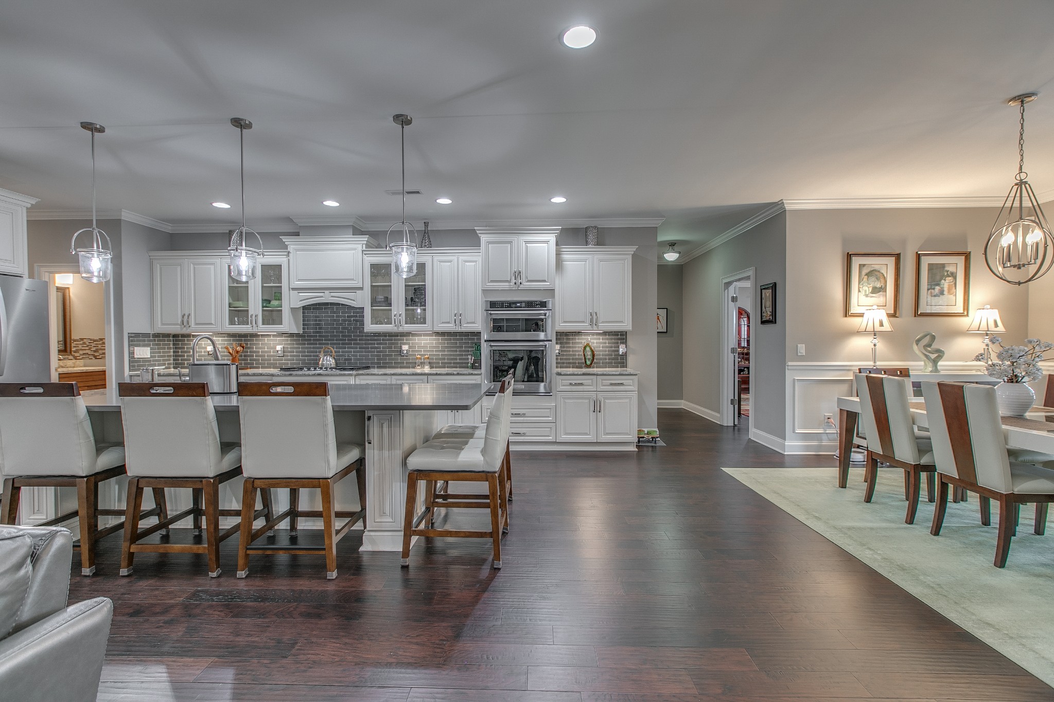 7745 Santos Drive Murfreesboro, TN 37129 - Photo 20 of 58 a kitchen with kitchen island granite countertop wooden floor and stainless steel appliances