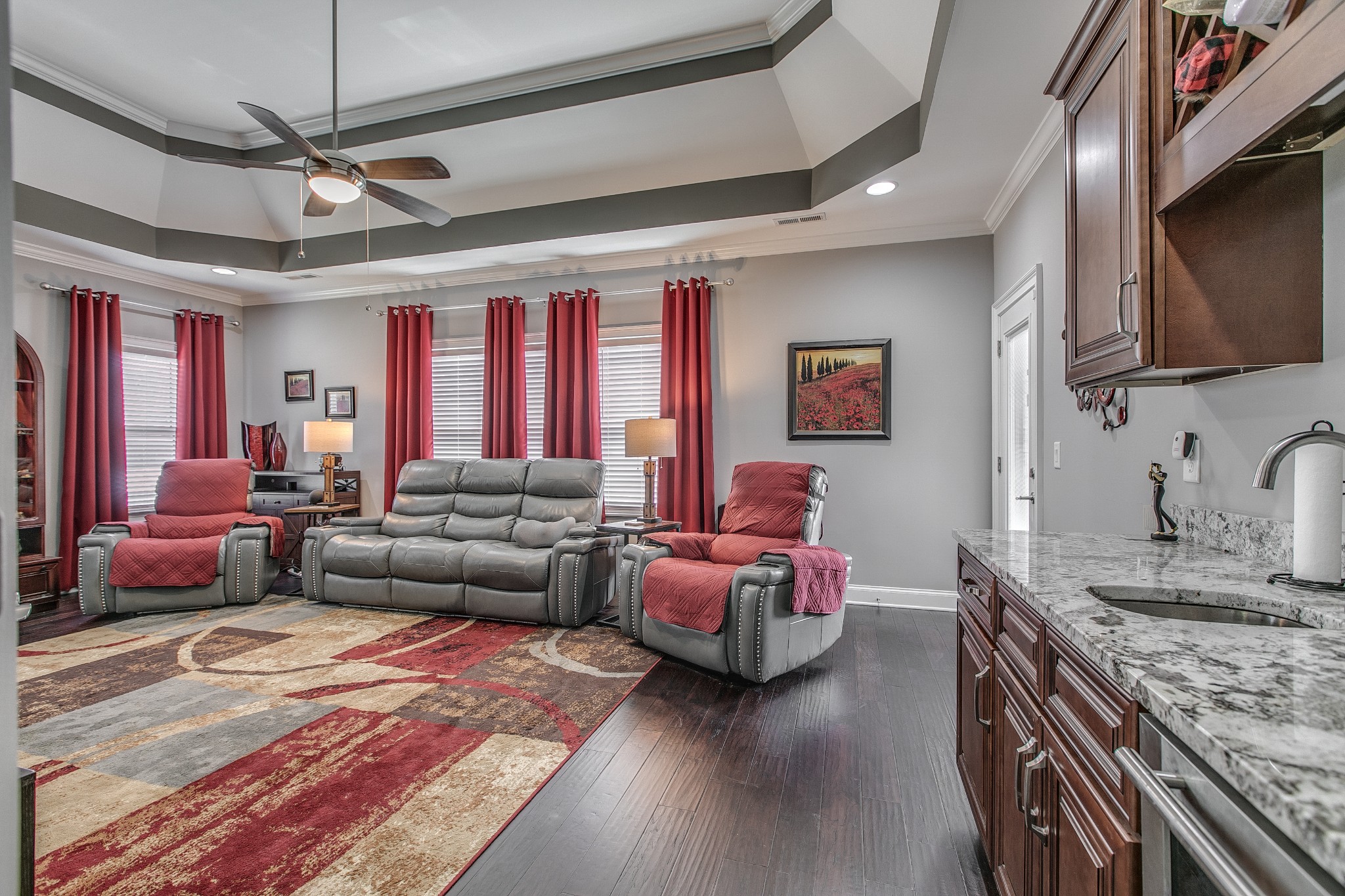 7745 Santos Drive Murfreesboro, TN 37129 - Photo 23 of 58 a living room with furniture kitchen view and a chandelier