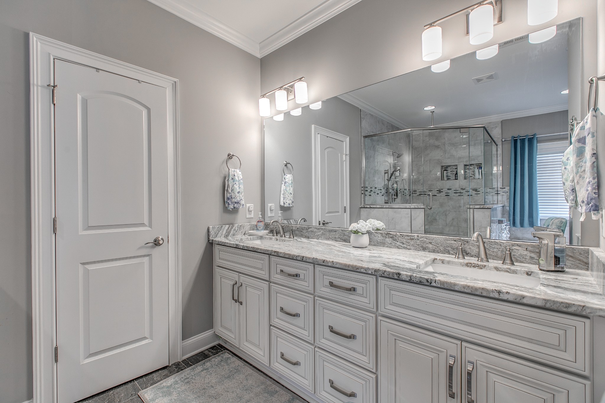 7745 Santos Drive Murfreesboro, TN 37129 - Photo 29 of 58 a bathroom with double sink and a mirror
