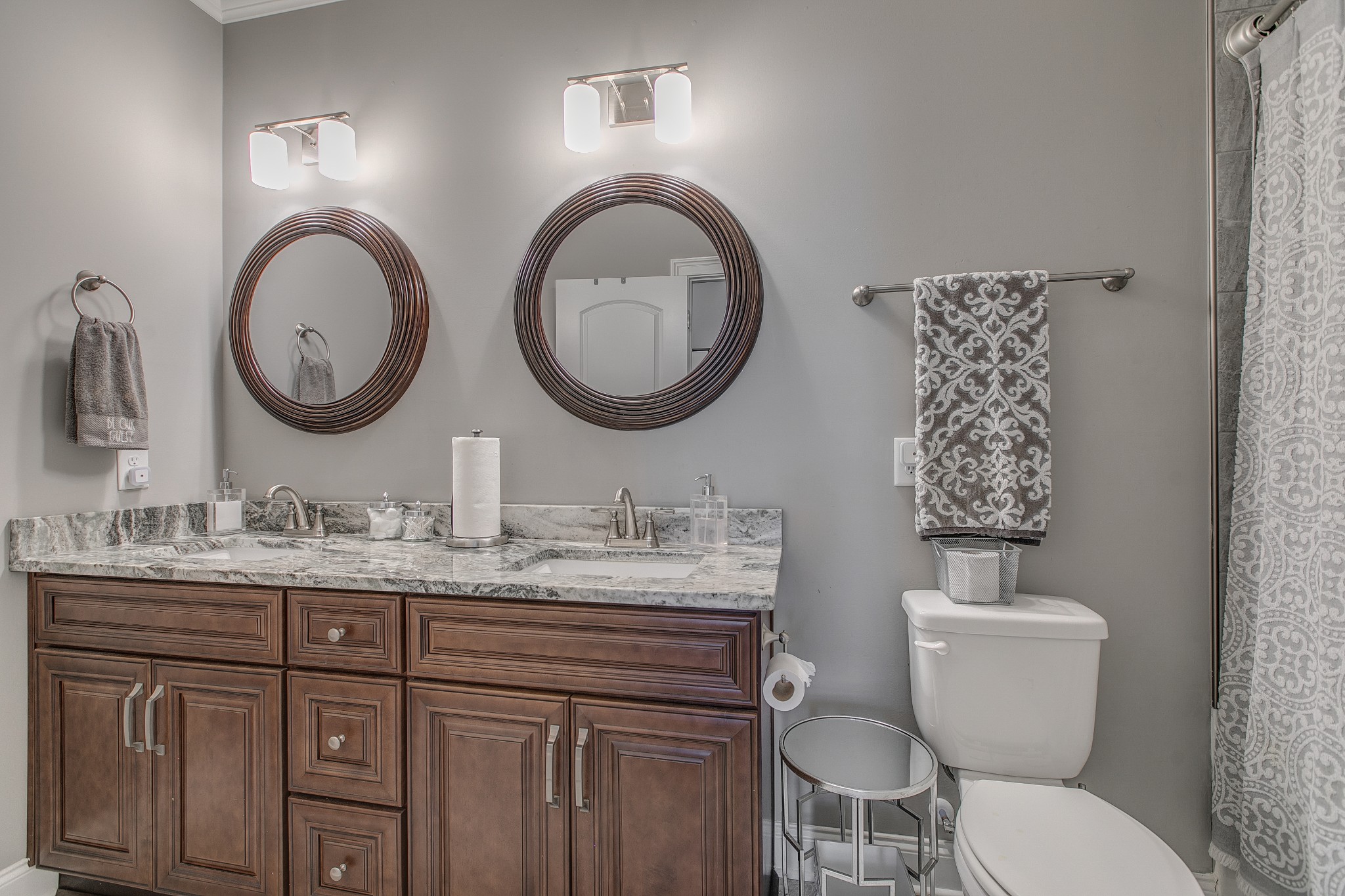 7745 Santos Drive Murfreesboro, TN 37129 - Photo 32 of 58 a bathroom with a toilet a sink and a mirror