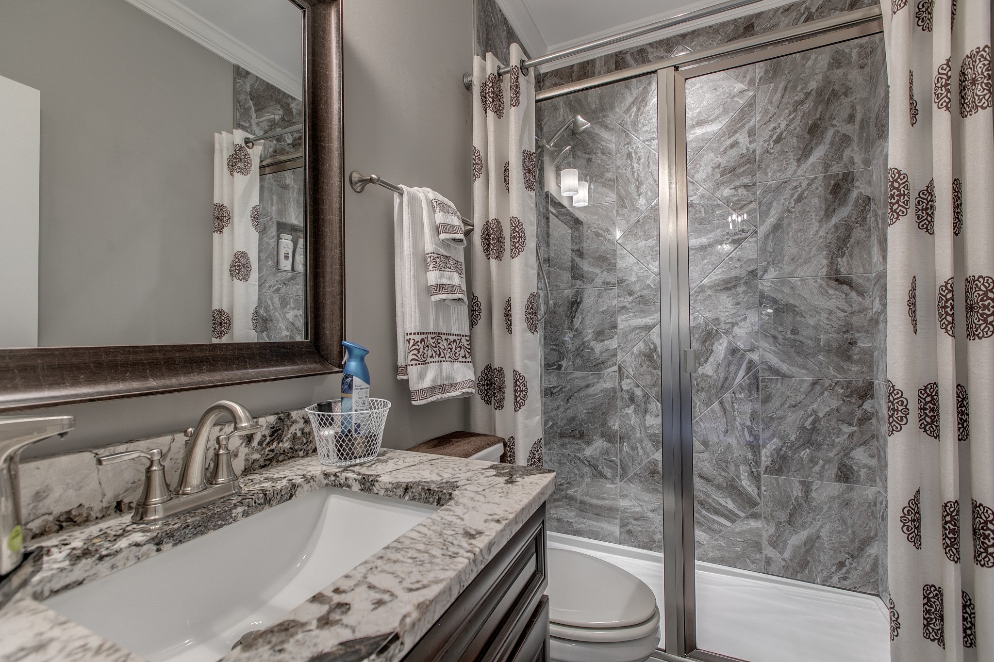 7745 Santos Drive Murfreesboro, TN 37129 - Photo 35 of 58 a bathroom with a granite countertop sink toilet and shower