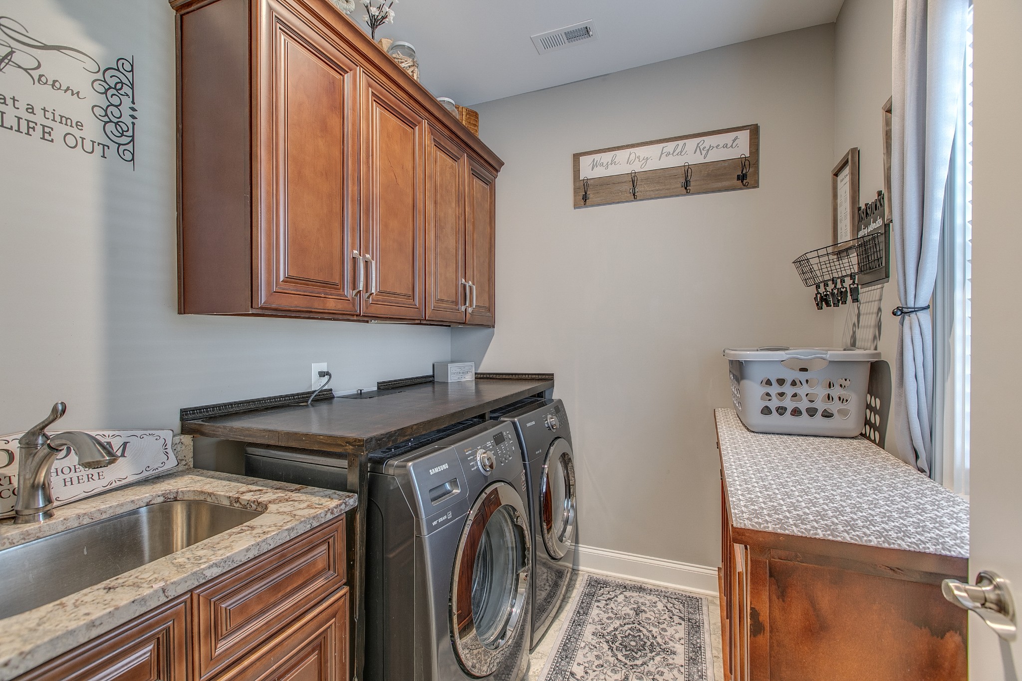 7745 Santos Drive Murfreesboro, TN 37129 - Photo 36 of 58 a utility room with sink dryer and washer