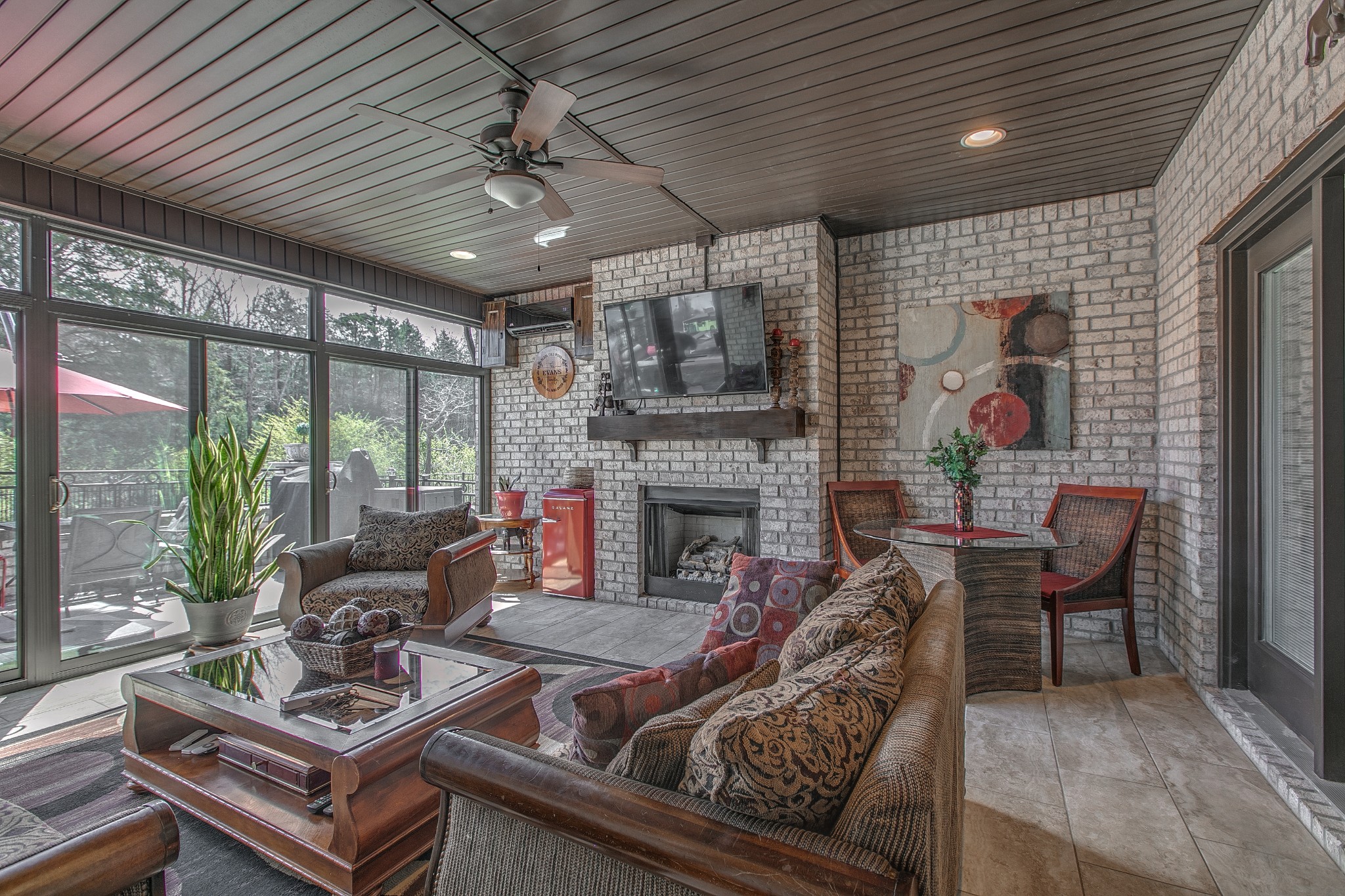 7745 Santos Drive Murfreesboro, TN 37129 - Photo 43 of 58 a living room with furniture a fireplace and a table