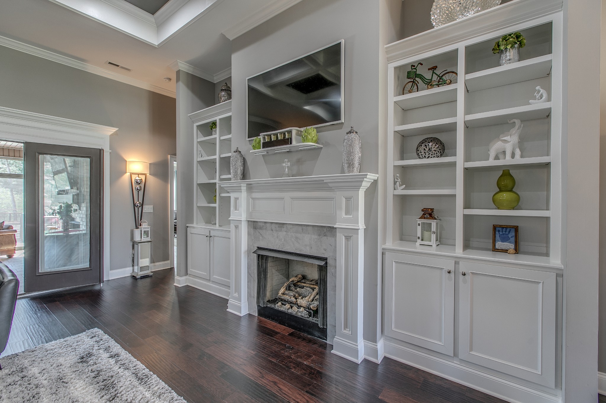 7745 Santos Drive Murfreesboro, TN 37129 - Photo 7 of 58 a living room with furniture and a fireplace