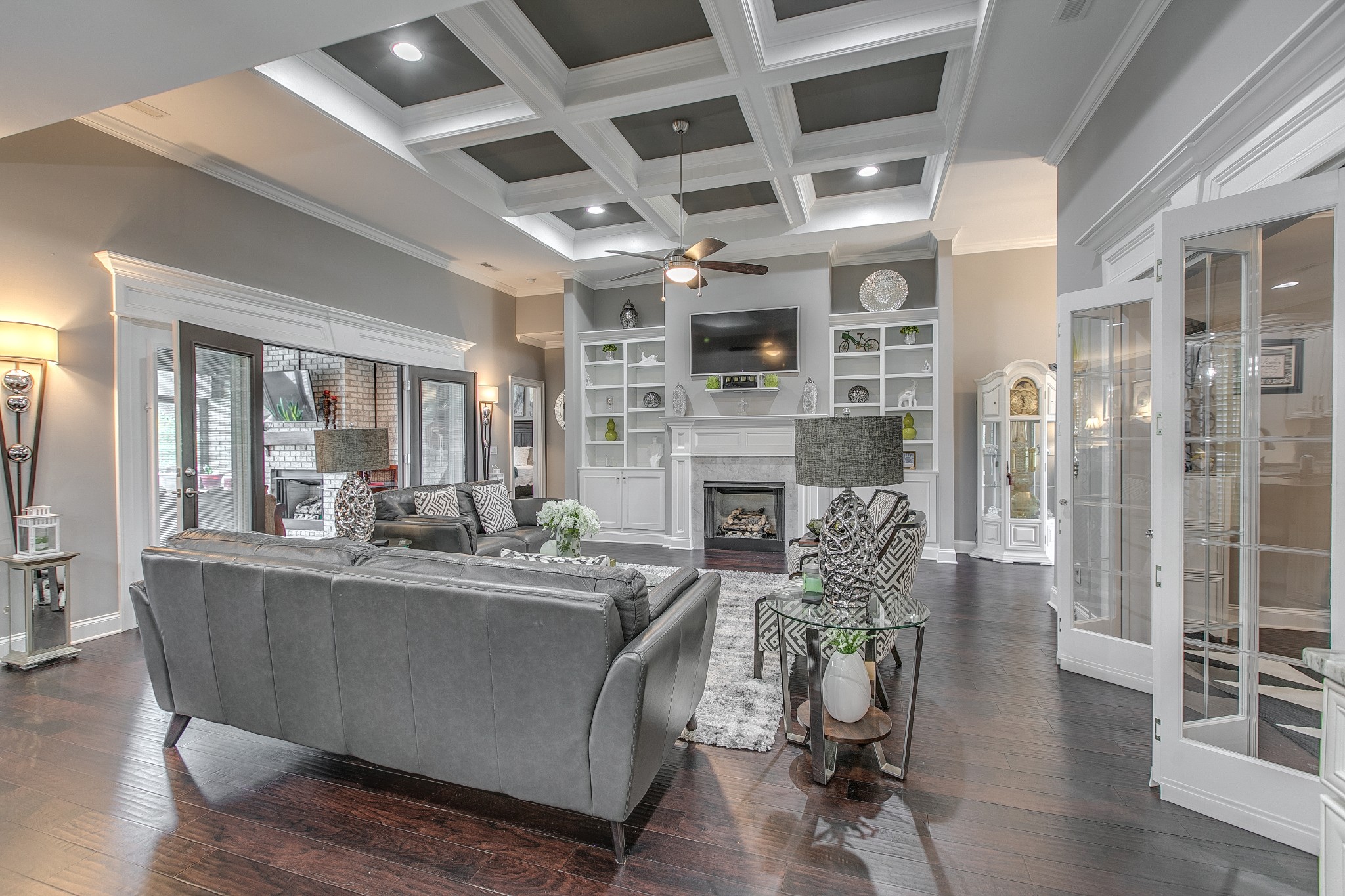 7745 Santos Drive Murfreesboro, TN 37129 - Photo 10 of 58 a dining room with furniture wooden floor and a fireplace