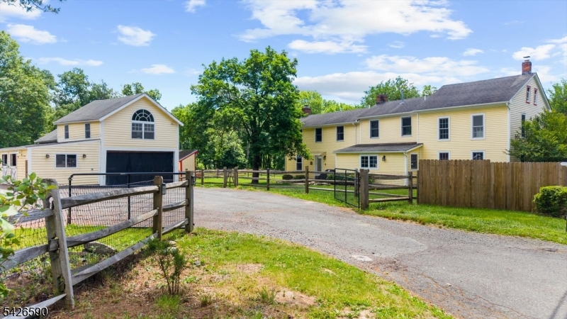 179 Lindbergh Road Hopewell, NJ 08525 - Photo 6 of 46 a front view of a house with yard and green space