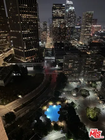 a kitchen with granite countertop a stove and a refrigerator