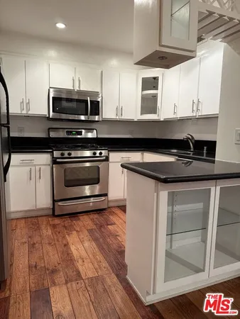a view of a room with wooden floor and closet