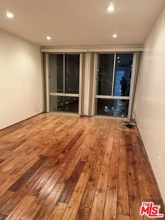 a bathroom with a bathtub shower sink vanity and toilet