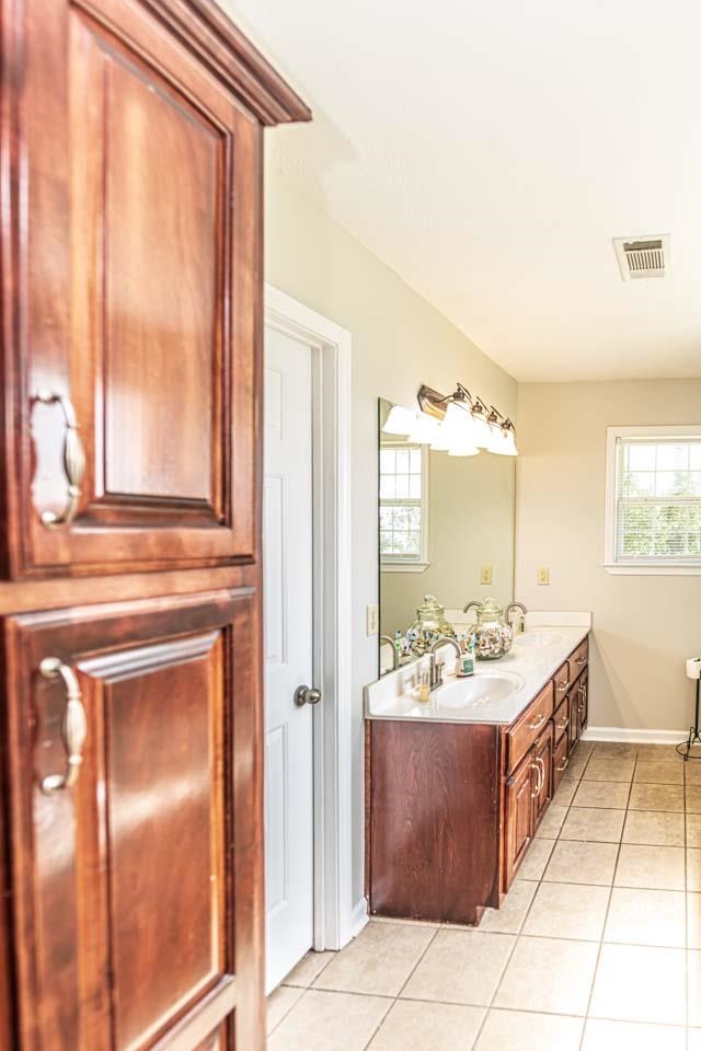 706 Liberty Church Smith Road Brighton, TN 38011 - Photo 23 of 35 a spacious bathroom with a mirror sink and vanity