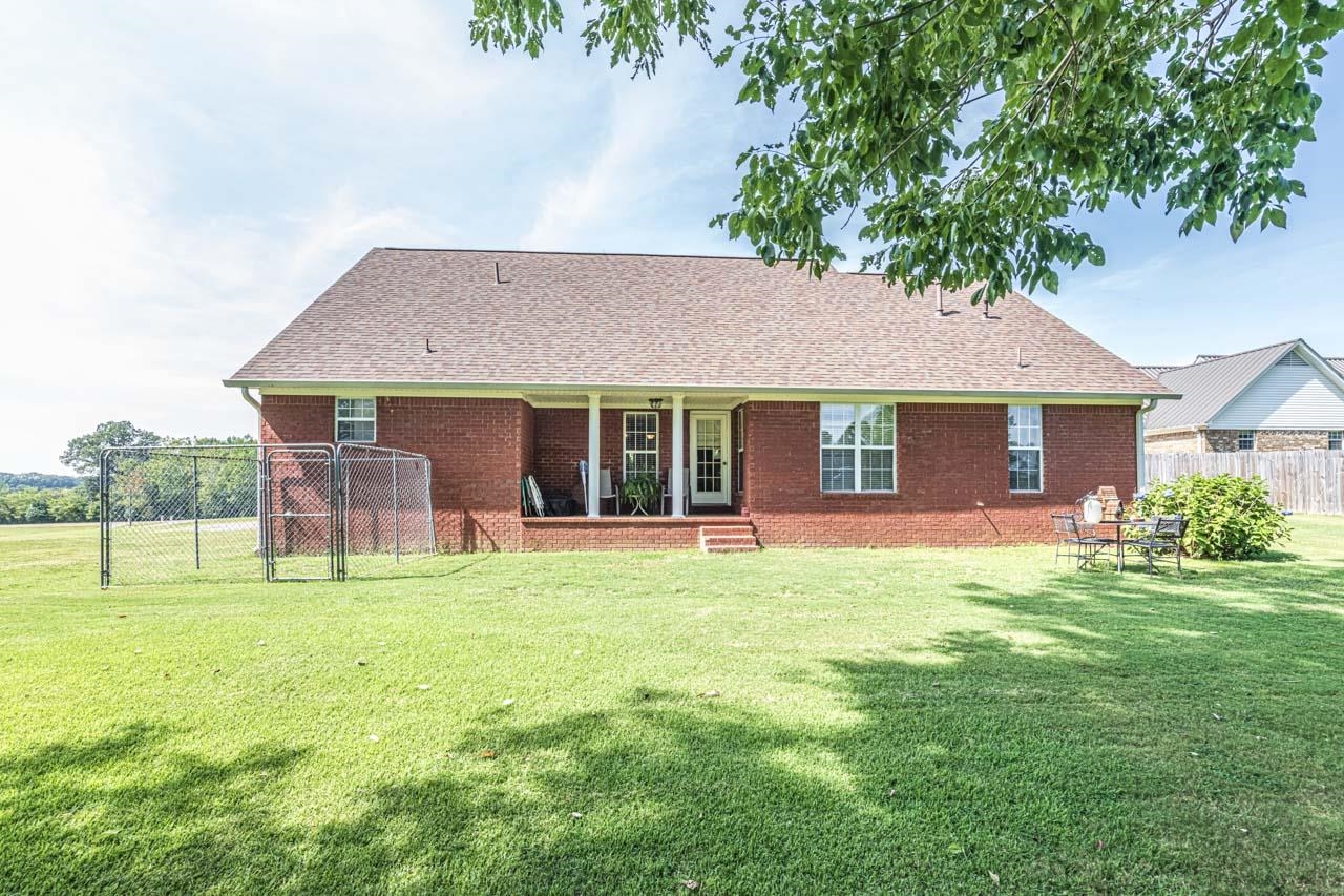 706 Liberty Church Smith Road Brighton, TN 38011 - Photo 4 of 35 a front view of a house with a yard and trees