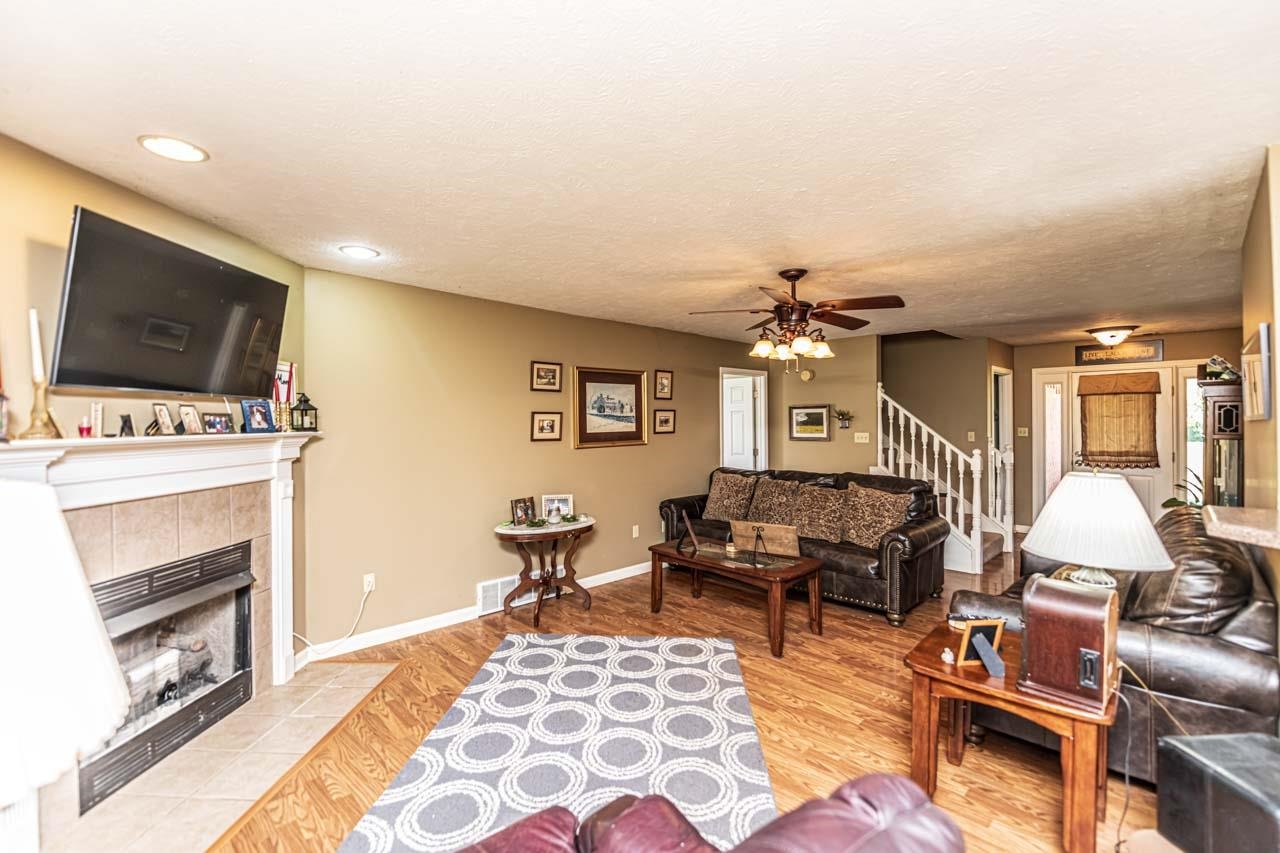 706 Liberty Church Smith Road Brighton, TN 38011 - Photo 8 of 35 a living room with furniture a flat screen tv and kitchen view