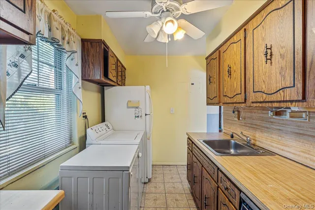 a kitchen with a sink a stove and a microwave