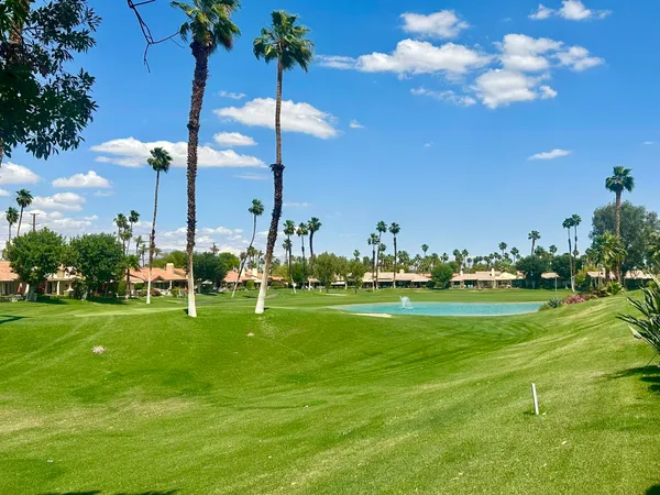 a view of a golf course with a lake