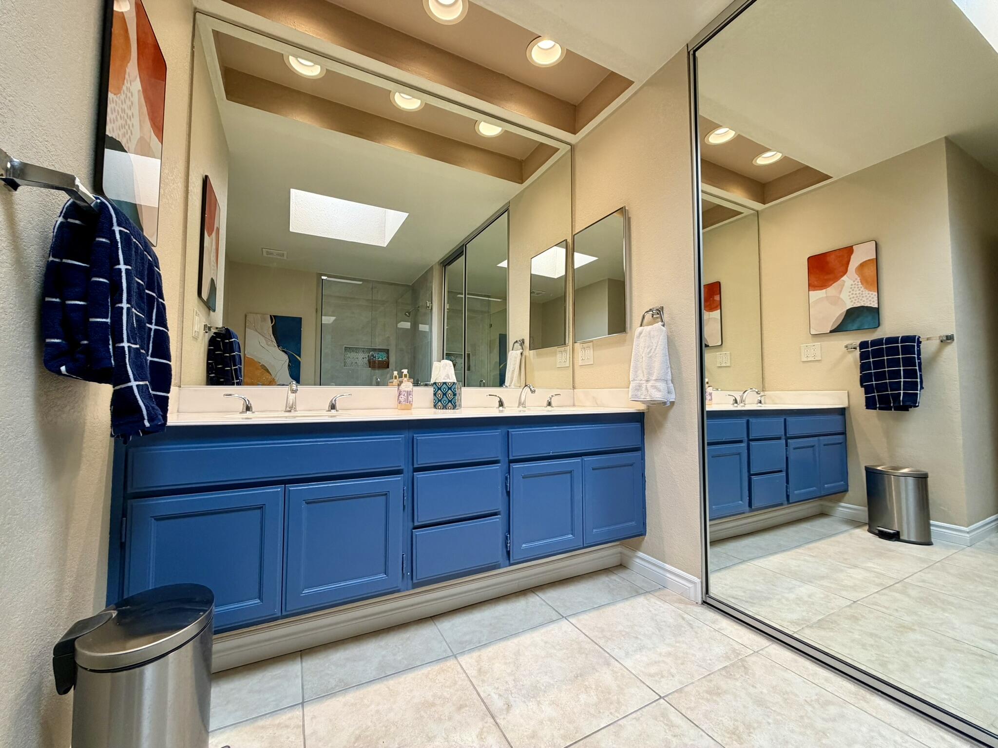 336 Villena Way Palm Desert, CA 92260 - Photo 13 of 19 a bathroom with a granite countertop sink and a mirror