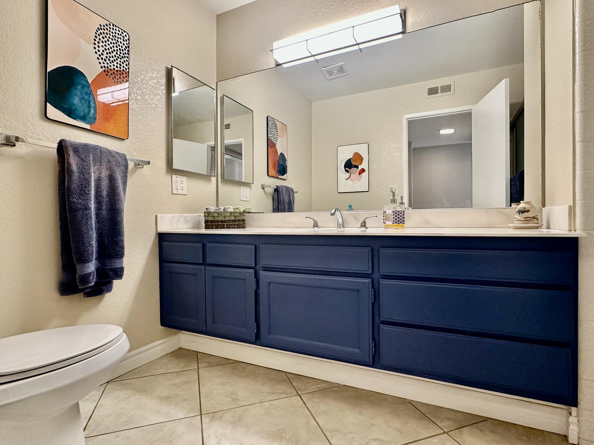 336 Villena Way Palm Desert, CA 92260 - Photo 16 of 19 a bathroom with a sink and a mirror