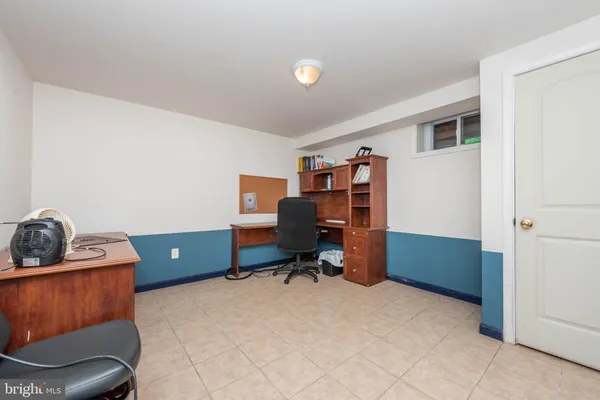 a bedroom with a workspace