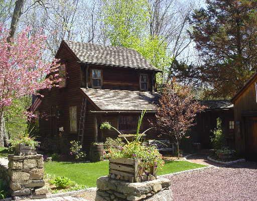 405 Westport Road Easton, CT 06612 - Photo 1 of 1 a front view of a house with garden