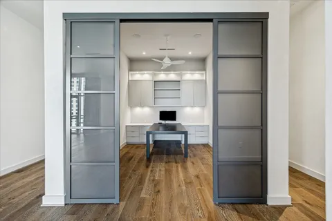 a dining room with furniture and wooden floor