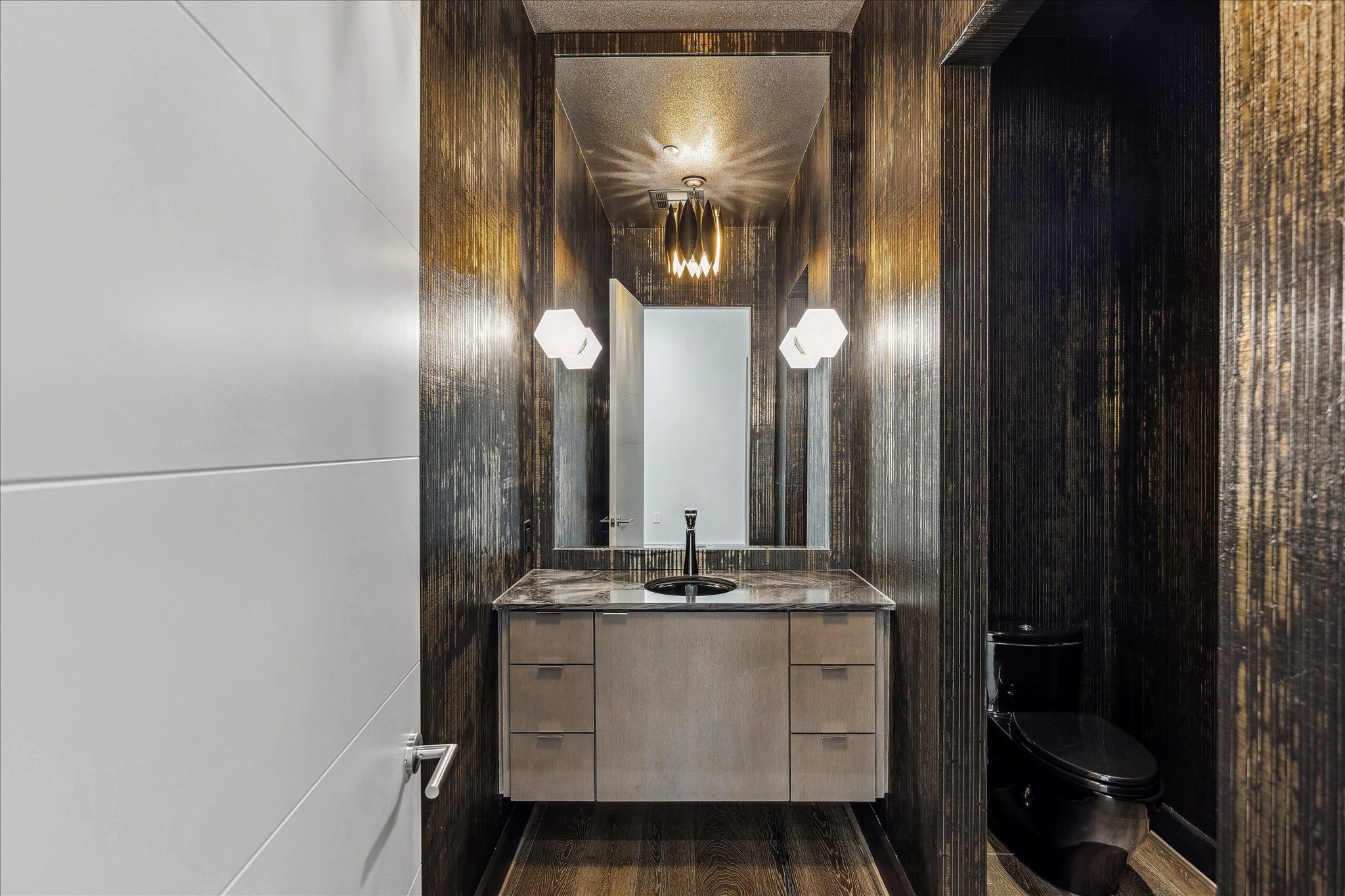 3331 D'Amico Street, Unit 1003 Houston, TX 77019 - Photo 18 of 46 a bathroom with a sink and a mirror