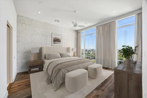 a bedroom with bed and a couch