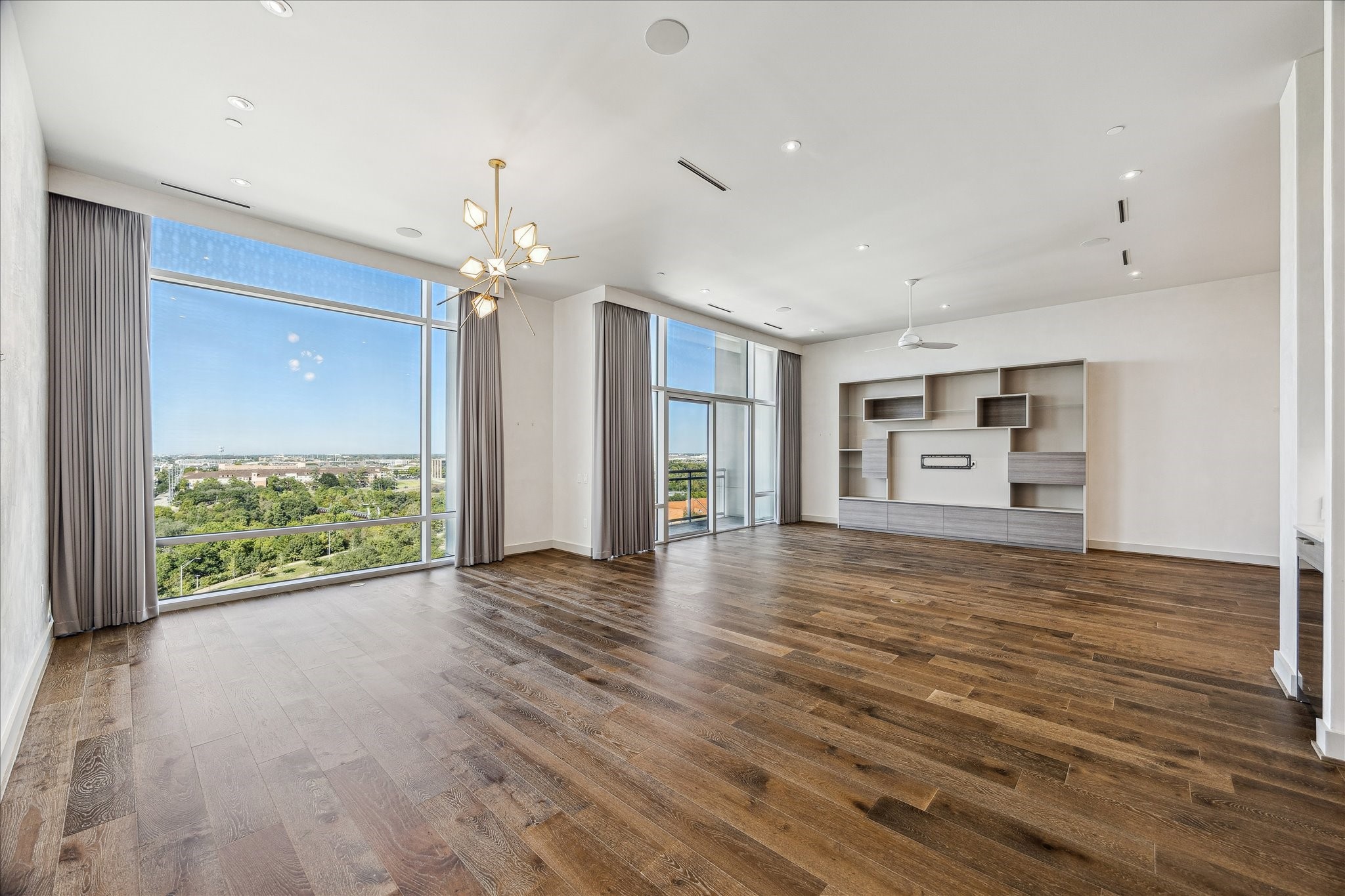 3331 D'Amico Street, Unit 1003 Houston, TX 77019 - Photo 2 of 46 a view of an empty room with a window and wooden floor